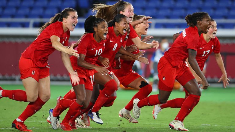 TOKYO, JAPAN - AUGUST 06: Team Canada celebrates after defeating Team Sweden in penalties to win gold the women&#39;s football gold medal match between Canada and Sweden on day fourteen of the Tokyo 2020 Olympic Games at International Stadium Yokohama on August 06, 2021 in Yokohama, Japan. (Photo by Abbie Parr/Getty Images)