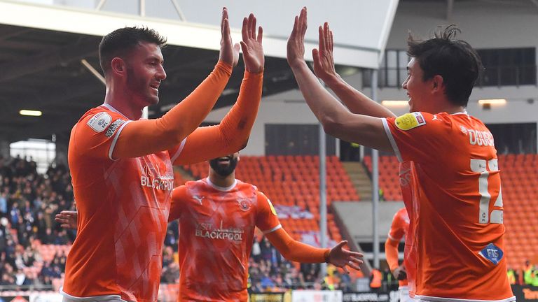 Gary Madine celebrates scoring Blackpool's second goal