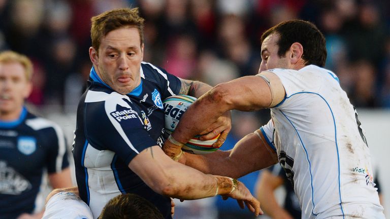 Oliver Wilkes of Scotland clashes with the Italian defence during the Scotland v Italy  Rugby League World Cup Group C match at Derwent Park on November 3, 2013 in Workington, England.(Photo by Mark Runnacles/Getty Images)