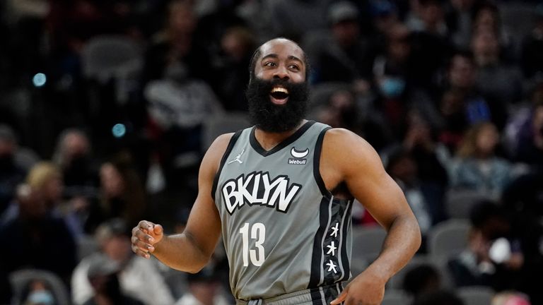 Brooklyn Nets guard James Harden smiles after scoring against the San Antonio Spurs during the second half of an NBA basketball game Friday, Jan. 21, 2022, in San Antonio.