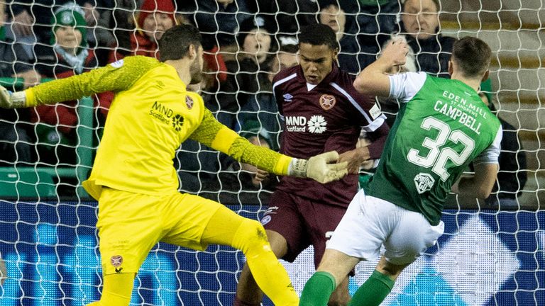 EDINBURGH, SCOTLAND - FEBRUARY 01: Hearts' Toby Sibbick blocks Hibs' Josh Campbell's shot late on during a cinch Premiership match between Hibernian and Heart of Midlothian at Easter Road, on February 01, 2022, in Edinburgh, Scotland.  (Photo by Ross Parker / SNS Group)