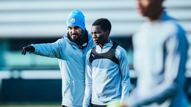 Ilkay Gundogan takes a training session with Manchester City's U16 side