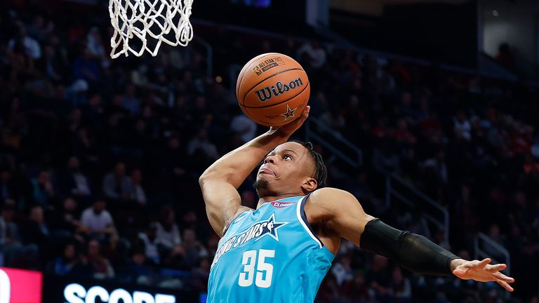 Team Barry's Isaac Okoro, of the Cleveland Cavaliers, goes up for a dunk against Team Payton during a semifinal of the NBA basketball Rising Stars event