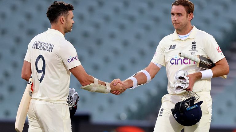 England&#39;s James Anderson, left, and Stuart Broad shake hands at the end of their Ashes cricket test match against Australia in Adelaide, Australia, Monday, Dec. 20, 2021. Australia wins the match by 275 runs. (AP Photo/James Elsby)
