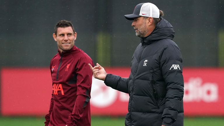 Liverpool manager Jurgen Klopp (right) and James Milner in discussion during a training session at the AXA Training Centre, Kirkby. Picture date: Monday October 18, 2021.