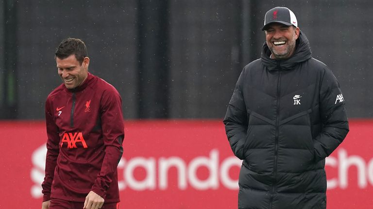 Liverpool manager Jurgen Klopp (right) and James Milner in discussion during a training session at the AXA Training Centre, Kirkby. Picture date: Monday October 18, 2021.