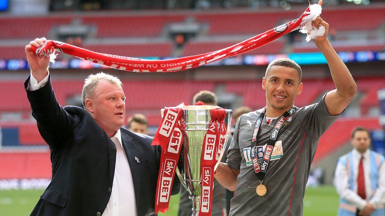 Steve Evans and James Tavernier celebrate promotion at Wembley with Rotherham