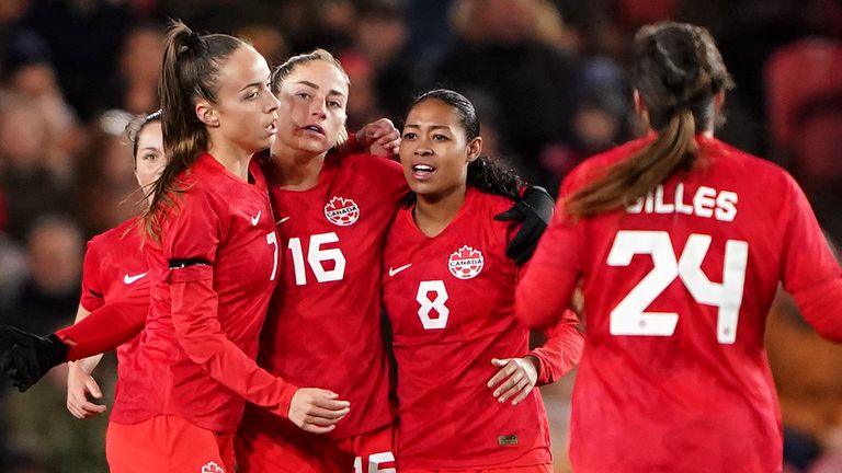 Canada&#39;s Janine Beckie (16) celebrates with team-mates after scoring vs England Women