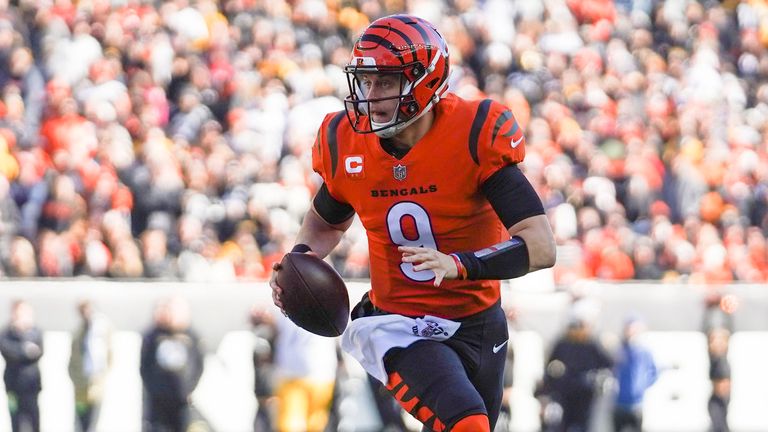Cincinnati Bengals quarterback Joe Burrow rushes into the end zone for a touchdown against the Pittsburgh Steelers