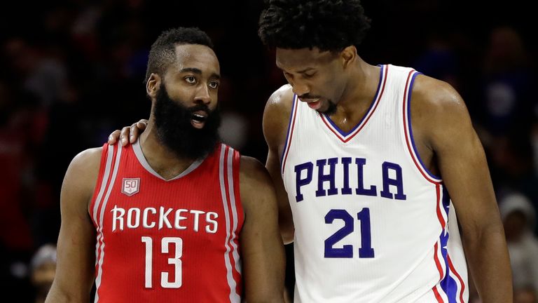 Joel Embiid (right) and James Harden discuss matters on court during a game in January 2017