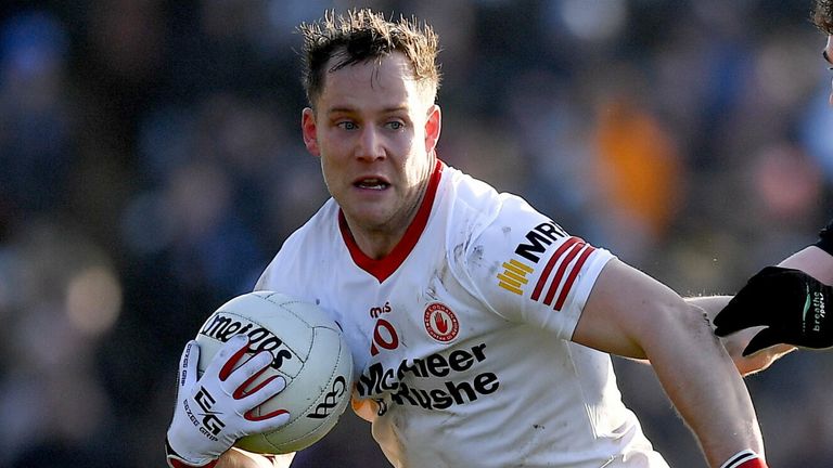 6 February 2022; Kieran McGeary of Tyrone is tackled by Jarly Og Burns of Armagh during the Allianz Football League Division 1 match between Armagh and Tyrone at the Athletic Grounds in Armagh. Photo by Brendan Moran/Sportsfile