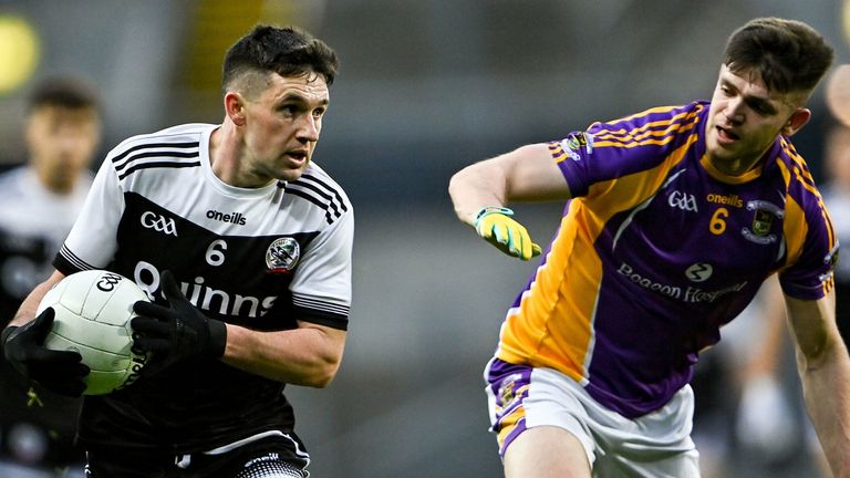 Daryl Branagan of Kilcoo in action against Cillian O'Shea of Kilmacud Crokes