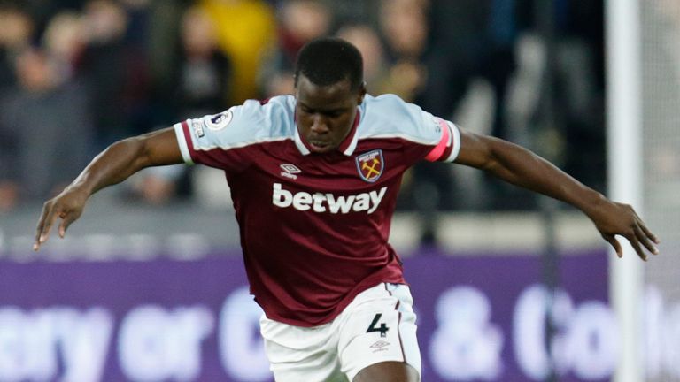 West Ham&#39;s Kurt Zouma runs with the ball during an English Premier League soccer match between West Ham United and Watford at the London stadium in London, Tuesday, Feb. 8, 2022.
