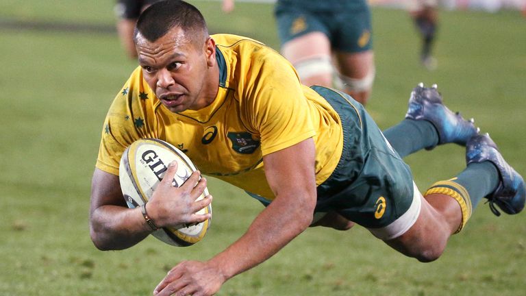 Australia's Kurtley Beale flies through the air to score a try against New Zealand during their rugby union test match in Sydney. Utility back Beale is joining French rugby club Racing 92 on a two-year deal from next season, the club announced Tuesday, May 12, 2020. (AP Photo/Rick Rycroft, File)