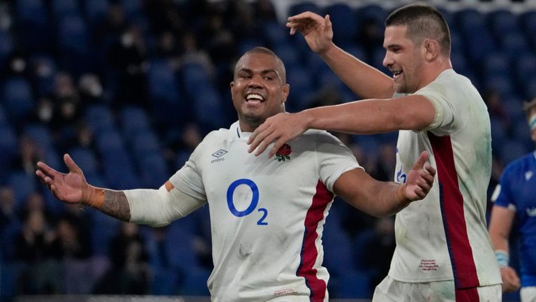 England's Kyle Sinckler, left, celebrates after scoring a try during the Six Nations rugby union match between Italy and England at the Stadio Olimpico in Rome, Italy, Sunday Feb. 13, 2022. (AP Photo/Gregorio Borgia)