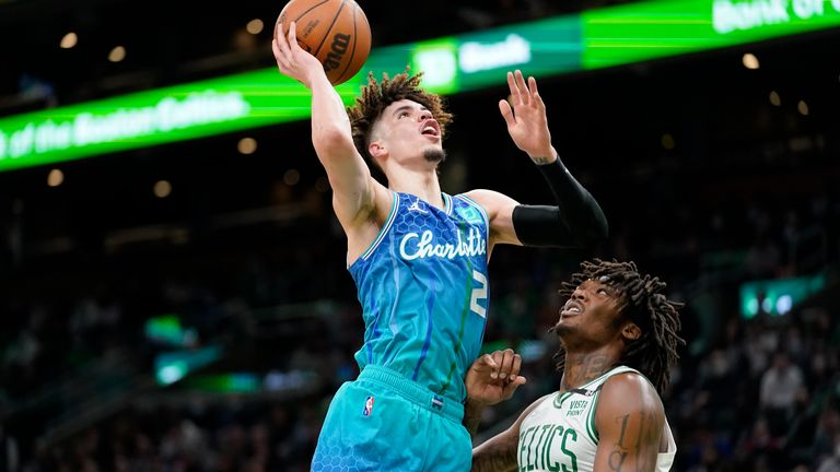 Charlotte Hornets guard LaMelo Ball (2) drives to the basket past Boston Celtics center Robert Williams III (44) during the second half of an NBA basketball game
