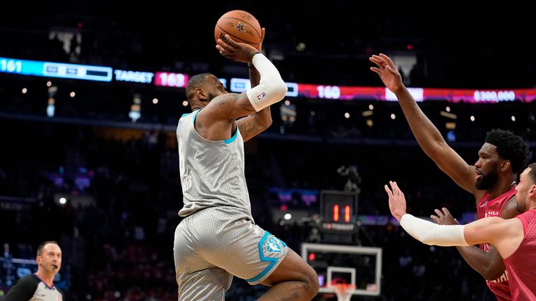 Los Angeles Lakers&#39; LeBron James, left, hits the game winning shot in the second half of the NBA All-Star basketball game, Sunday, Feb. 20, 2022, in Cleveland.