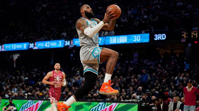 Los Angeles Lakers' LeBron James drives to the basket during the NBA All-Star game in Cleveland.