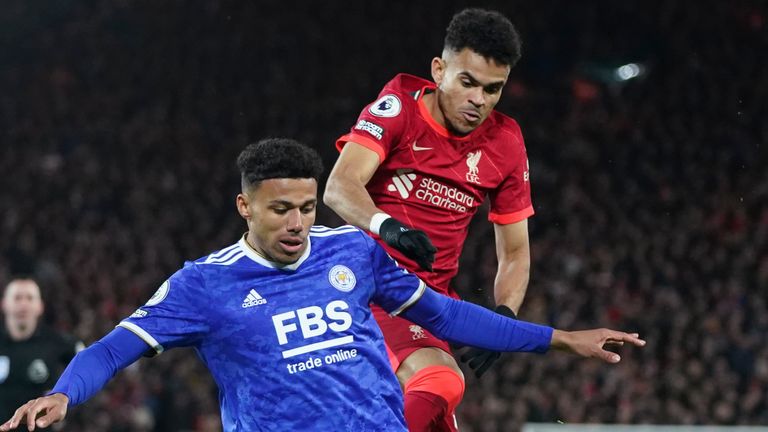 Leicester's James Justin challenges for the ball with Liverpool's Luis Diaz 