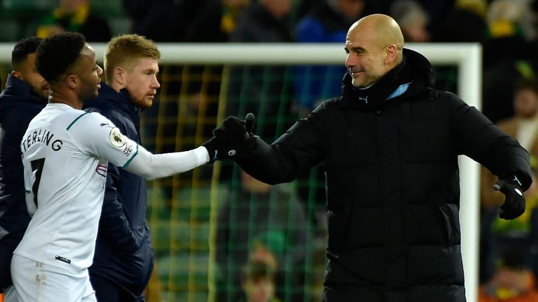 Pep Guardiola shakes hands with Raheem Sterling after Manchester City's win at Norwich