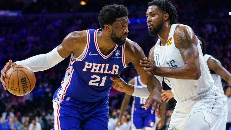 Philadelphia 76ers' Joel Embiid, left, is defended by Oklahoma City Thunder's Derrick Favors during the second half of an NBA basketball game Friday, Feb. 11, 2022, in Philadelphia. The 76ers won 100-87. 