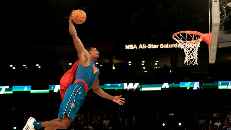 Wearing a Superman costume, Orlando Magic forward Dwight Howard soars toward the basket in the basketball slam dunk contest Saturday, Feb. 16, 2008, at the NBA All Star Weekend in New Orleans