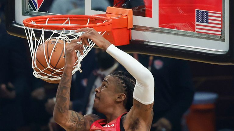 Memphis Grizzlies' Ja Morant dunks the ball during the first half of the NBA All-Star basketball game, Sunday, Feb. 20, 2022, in Cleveland.