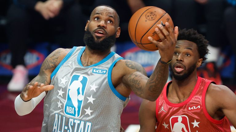 Los Angeles Lakers&#39; LeBron James, left, puts up a shot in front of Golden State Warriors&#39; Andrew Wiggins during the first half of the NBA All-Star basketball game