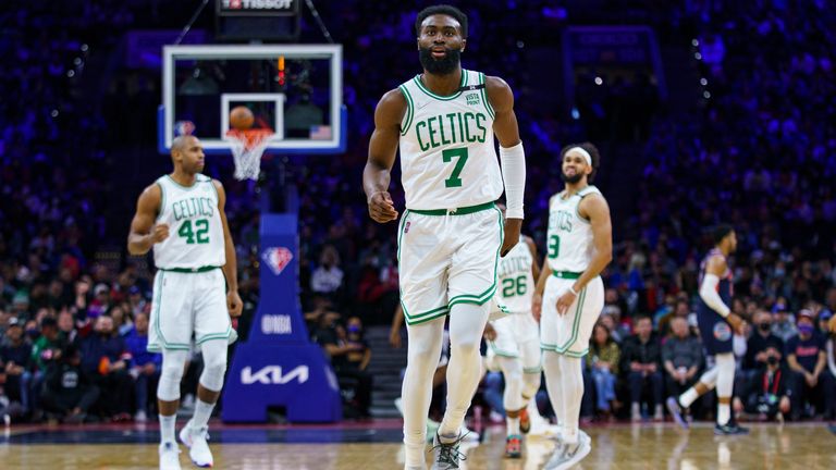 Boston Celtics&#39; Jaylen Brown, front, reacts to his 3-point shot during the first half of the team&#39;s NBA basketball game against the Philadelphia 76ers, Tuesday, Feb. 15, 2022, in Philadelphia.