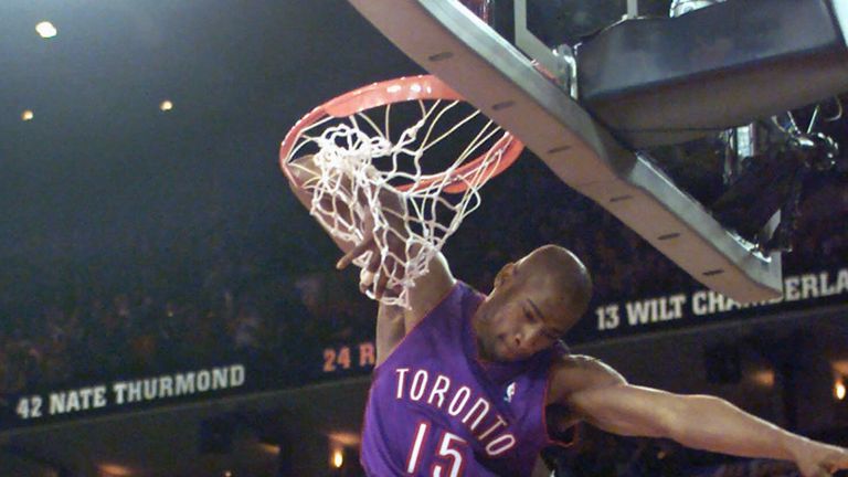  In this Feb. 12, 2000, file photo, Toronto Raptors Vince Carter hangs from his elbow on his fourth dunk during the slam dunk competition during the NBA All-Star weekend in Oakland, Calif. Carter is no longer the NBA&#39;s highest flyer, though he&#39;s certainly not ready to be grounded.