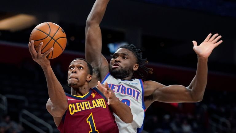 Cleveland Cavaliers guard Rajon Rondo (1) is defended by Detroit Pistons center Isaiah Stewart during the second half of an NBA basketball game, Thursday, Feb. 24, 2022, in Detroit
