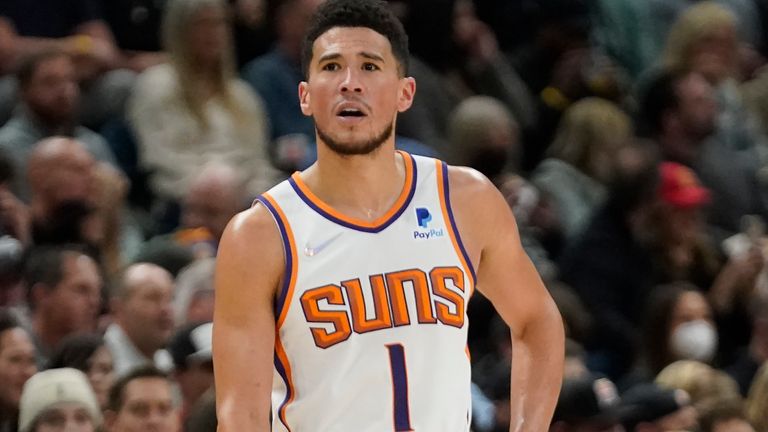 Phoenix Suns guard Devin Booker (1) looks on in the second half during an NBA basketball game against the Utah Jazz Wednesday, Jan. 26, 2022, in Salt Lake City. (AP Photo/Rick Bowmer)