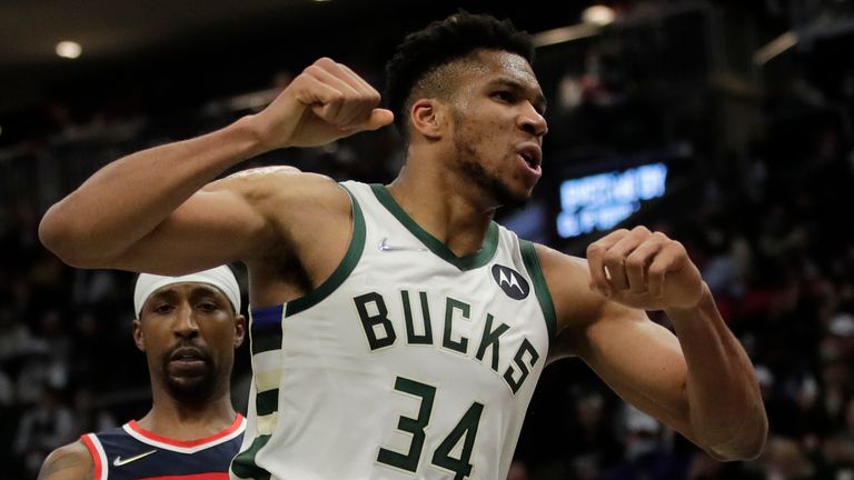 Milwaukee Bucks&#39; Giannis Antetokounmpo (34) reacts after a dunk during the second half of an NBA basketball game against the Washington Wizards Tuesday, Feb. 1, 2022, in Milwaukee. 