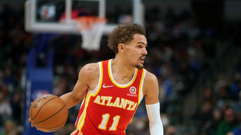 Atlanta Hawks guard Trae Young (11) dribbles during the first quarter of an NBA basketball game against the Dallas Mavericks 