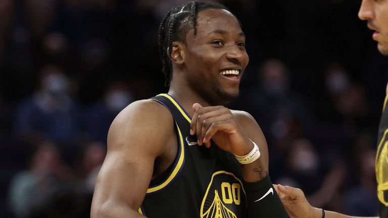 Golden State Warriors forward Jonathan Kuminga (00) is congratulated by teammate forward Nemanja Bjelica (8) after scoring against the Dallas Mavericks during the second half of an NBA basketball game in San Francisco, Tuesday, Jan. 25, 2022. (AP Photo/Jed Jacobsohn)