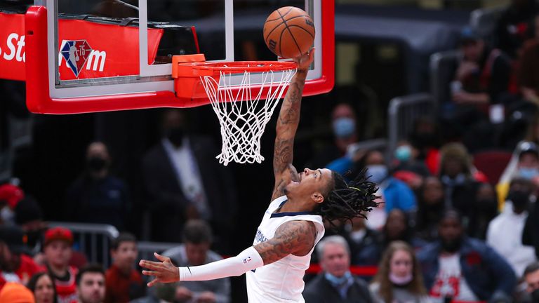 Memphis Grizzlies guard Ja Morant (12) drives to the basket for a layup during a NBA game between the Memphis Grizzlies and the Chicago Bulls on February 26, 2022 at the United Center in Chicago, IL. 