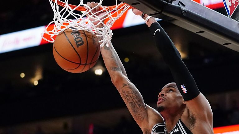 San Antonio Spurs guard Dejounte Murray scores during the second half of an NBA basketball game against the Atlanta Hawks Friday, Feb. 11, 2022, in Atlanta. 