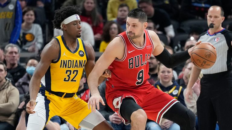 Chicago Bulls center Nikola Vucevic (9) moves to the basket in front of Indiana Pacers guard Terry Taylor (32) during the first half of an NBA basketball game in Indianapolis, Friday, Feb.  4, 2022.