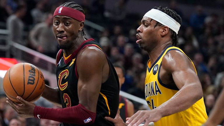 Cleveland Cavaliers' Caris LeVert goes to the basket against Indiana Pacers' Buddy Hield during the first half of an NBA basketball game Friday, Feb. 11, 2022, in Indianapolis.