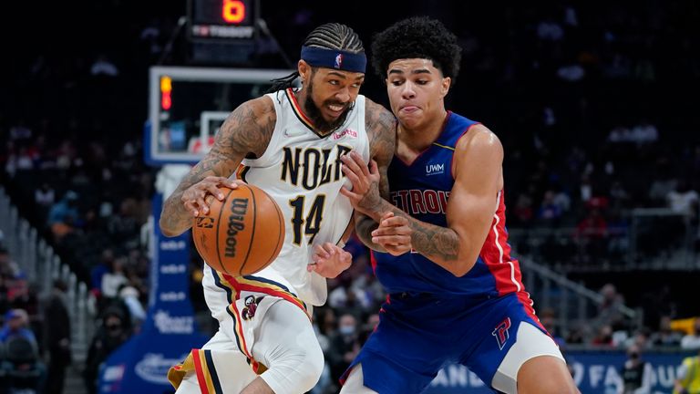 New Orleans Pelicans forward Brandon Ingram (14) drives on Detroit Pistons guard Killian Hayes (7) in the second half of an NBA basketball game in Detroit, Tuesday, Feb. 1, 2022.