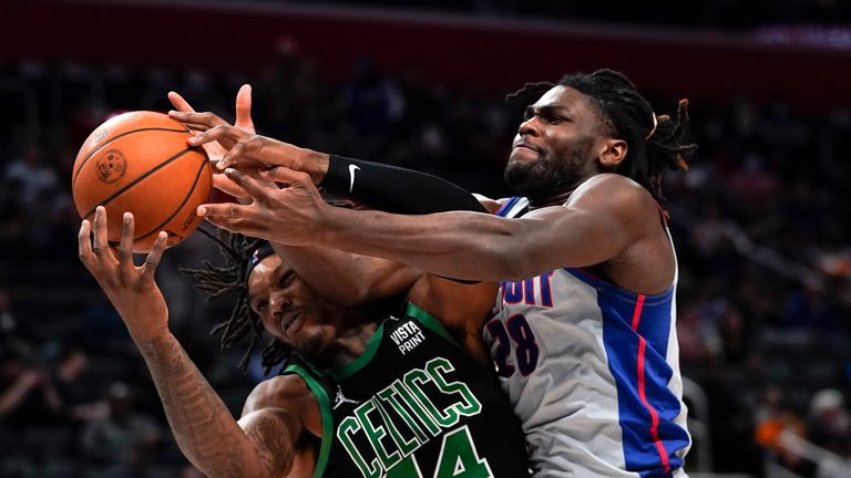 Boston Celtics center Robert Williams III (44) and Detroit Pistons center Isaiah Stewart (28) battle for a rebound in the second half of an NBA basketball game in Detroit, Friday, Feb.  4, 2022.