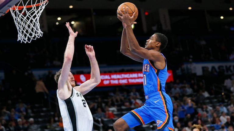 Oklahoma City Thunder guard Theo Maledon shoots against San Antonio Spurs center Jakob Poeltl during the second half of an NBA basketball game Wednesday, Feb. 16, 2022, in Oklahoma City.