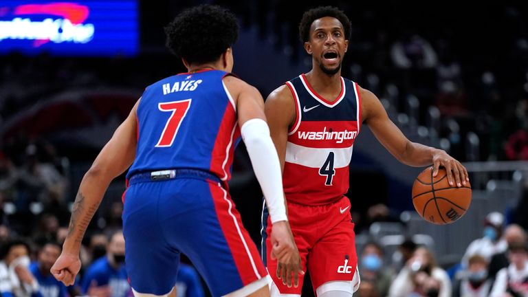 Washington Wizards guard Ish Smith (4) is defended by Detroit Pistons guard Killian Hayes (7) during the first half of an NBA basketball game Monday, Feb. 14, 2022, in Washington. (AP Photo/Evan Vucci)