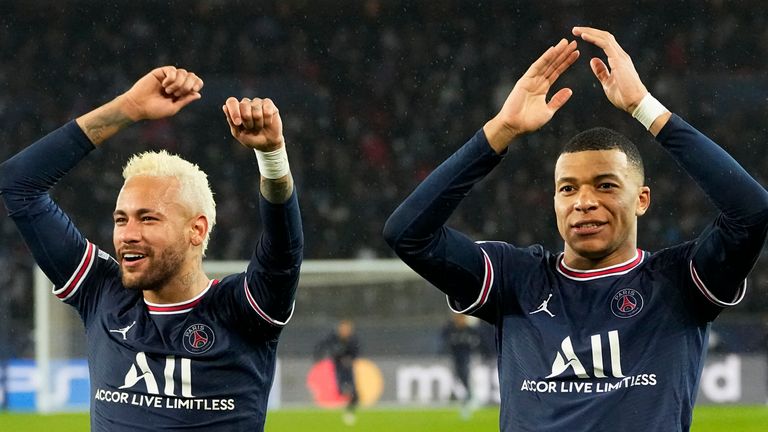 PSG's Kylian Mbappe, right, and PSG's Neymar celebrate after the Champions League round of 16, first leg, soccer match Paris Saint-Germain against Real Madrid at the Parc des Princes stadium in Paris, Tuesday, Feb.15, 2022. 