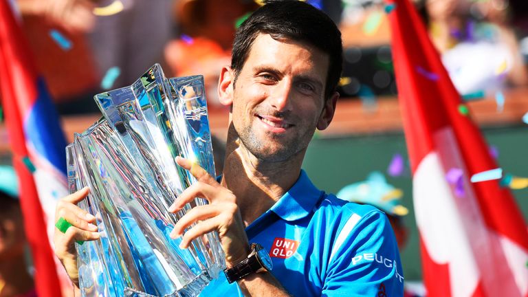 Novak Djokovic (SRB) poses with the trophy after defeating Milos Raonic (CAN) in the men&#39;s singles final at the BNP Paribas Open played at the Indian Wells Tennis Garden, Indian Wells, CA (Photo by Cynthia Lum/Icon Sportswire) (Icon Sportswire via AP Images)