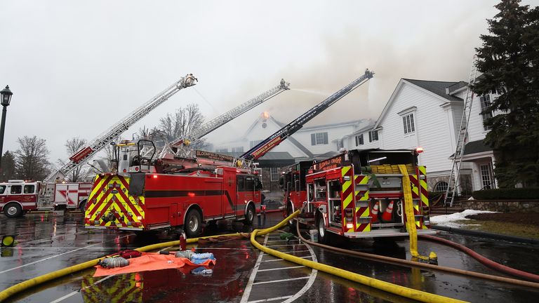 Firefighters battle blaze which has left the clubhouse at the iconic Oakland Hills Country Club in ruins