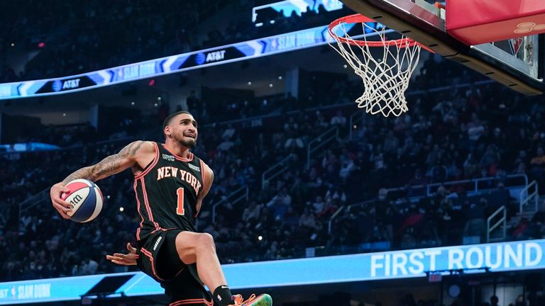 New York Knicks Obi Toppin leaps towards the basket during the dunk contest part of the skills challenge competition, part of NBA All-Star basketball game weekend, Saturday, Feb. 19, 2022, in Cleveland.