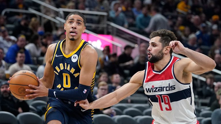 Indiana Pacers&#39; Tyrese Haliburton (0) goes to the basket against Washington Wizards&#39; Raul Neto (19) during the first half of an NBA basketball game, Wednesday, Feb. 16, 2022, in Indianapolis. Indiana won 113-108