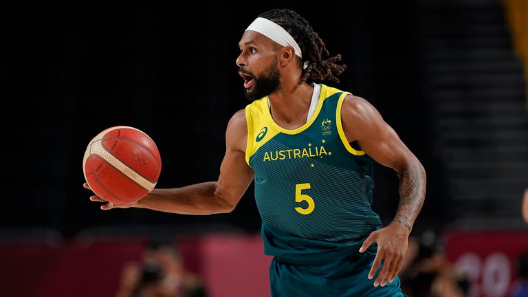 Australia&#39;s Patty Mills dribbles the ball during the men&#39;s bronze medal match at the Tokyo 2020 Summer Olympics