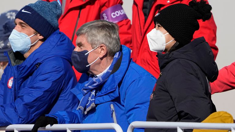 China's Peng Shuai, right, watches the women's freestyle skiing big air finals with Thomas Bach, center, President of the International Olympic Committee at the 2022 Winter Olympics, Tuesday, Feb. 8, 2022, in Beijing. (AP Photo/Jae C. Hong)